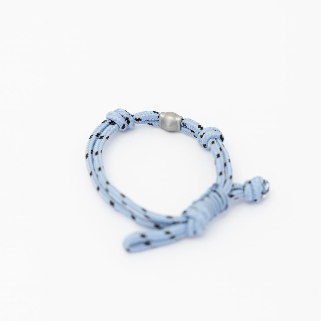 Lükii Light blue bracelet with black pattern and silver bead on a white background
