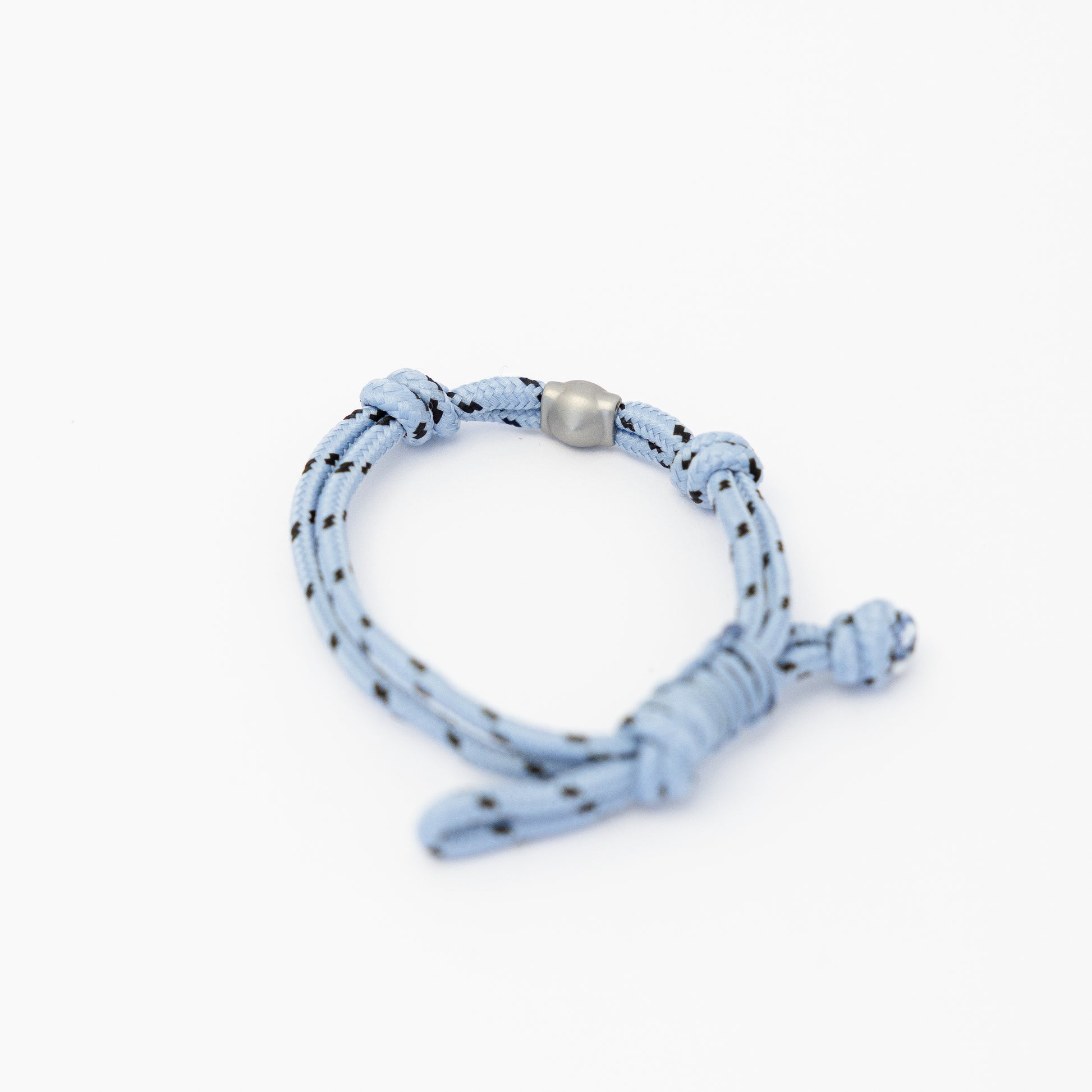 Lükii Light blue bracelet with black pattern and silver bead on a white background