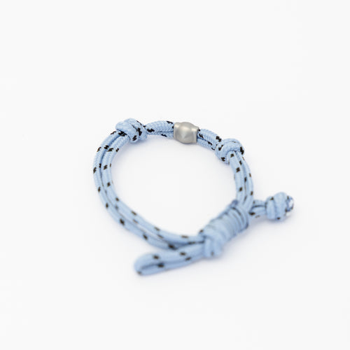 Lükii Light blue bracelet with black pattern and silver bead on a white background